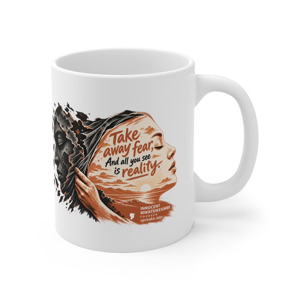 Take Away Fear white ceramic mug, handle on the right, showing a hand drawing back a cracked mask beside a face filled with a sunlit landscape.