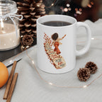 Finite Time white ceramic mug filled with a drink, handle on the right, beside a candle, pinecones and string lights.